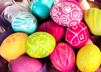 Fototapeta na wymiar Closeup of beautiful Easter eggs with their hands. A festive mood. 