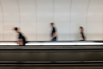 Motion blur of people in a subway in Montparnasse