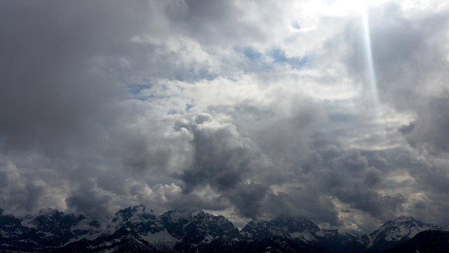 Dramatic sky in front of mountain chain in the Austrian Alps, Winter landscape Austria Europe