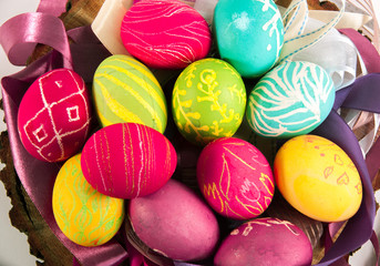 Closeup of beautiful Easter eggs with their hands. A festive mood. 
