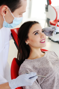 dentist examines teeth attractive girl.prevention of dental caries, enamel, dental fillings