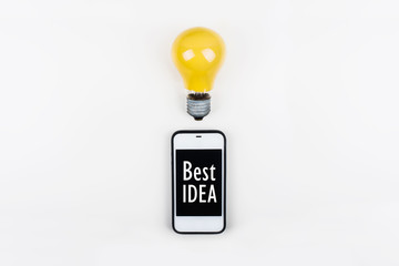 idea concept with light bulbs and smartphone,cell phone with motivation text