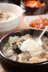 bajirak sujebi. Hand-pulled Dough Soup with manila clam.