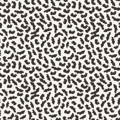 Seamless pattern of abstract strokes and dots.