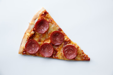 Pepperoni pizza. Hot homemade food. Slice of fresh italian classic salami pizza. Popular topping with cheese. Baked meal.