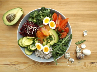 Bowl Buddha. The concept of a healthy vegetarian diet. Boiled barley and quail eggs, raw vegetables