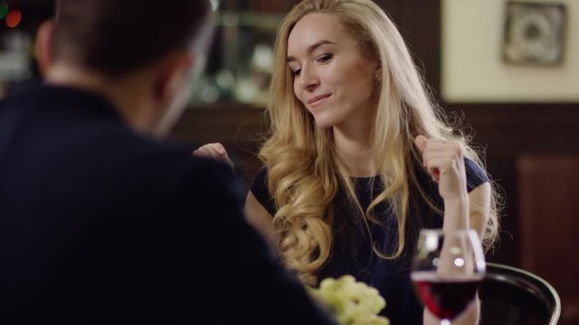 curling charming beauty telling with partner in cafe