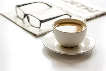 Business lunch with coffee and newspaper on white table top view