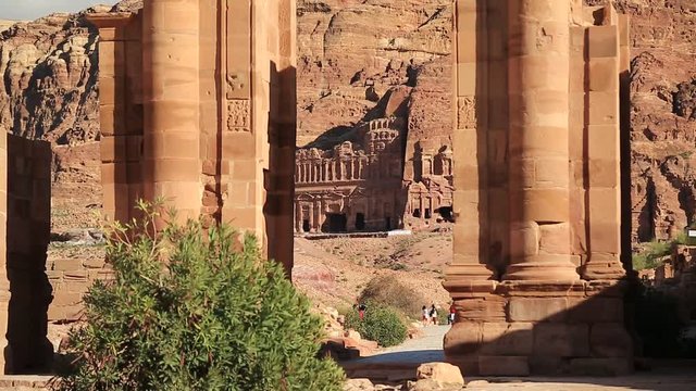 Temenos Gate and Colonnade Street in Petra - ancient historical and archaeological rock-cut city in Hashemite Kingdom of Jordan. Royal Tombs carved in the mountain on the background