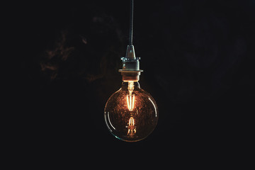 Vintage edison lightbulb on dark background