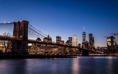 Fototapeta na wymiar Brooklyn Bridge and Manhattan Skyline at sunset - New York, USA