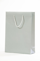 Gray paper bag isolated on white background.