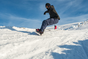 Fototapeta na wymiar Snowboard freerider in the mountains