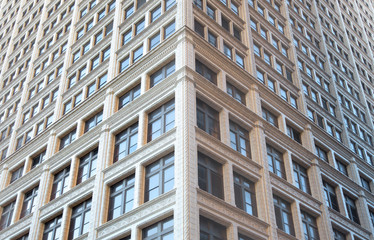 Fototapeta premium Tall building with lot of windows symmetric view