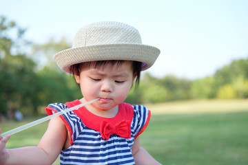 Cute Baby girl playing in the garden, close-up portrait, Portrait of a beautiful baby girl