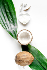 organic cosmetics with coconut on white background top view