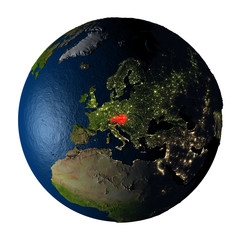 Naklejka premium Austria in red on Earth isolated on white