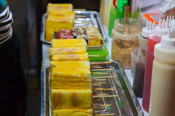 Toast is being prepared for sale in night market,Thailand
