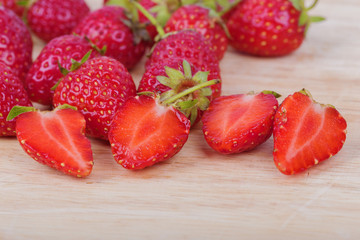 Fresh ripe strawberry on wood