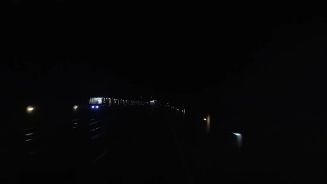 Metro underground tube subway tunnel POV from moving train to rails and station.