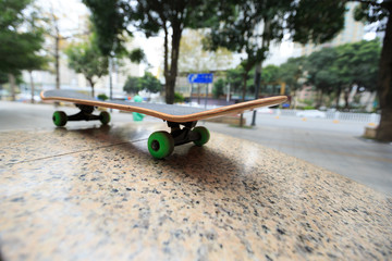 closeup of  skateboard at city skatepark waiting for riding