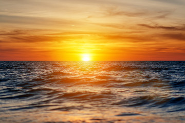Naklejka na ściany i meble beautiful sunset in the sea