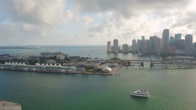 Miami Aerial v1 Flying over main channel panning with cityscape, cruise terminal and shipyard views.