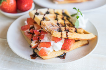 waffle with strawberry on wood