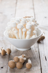 White shimeji mushrooms on wood background