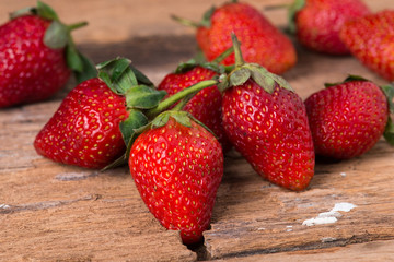 Strawberry on wooden background close up