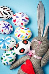 Easter bunny on a blue background. Rabbit. Easter ideas. Easter eggs. Space for text. Happy easter.