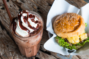 Ice chocolate with whipped cream on table