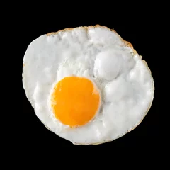 Fotobehang Spiegeleieren top view of fried eggs on black background