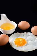 fried eggs on black background, egg
