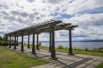 Wooden bower outside in the sunny day with sea on the background 