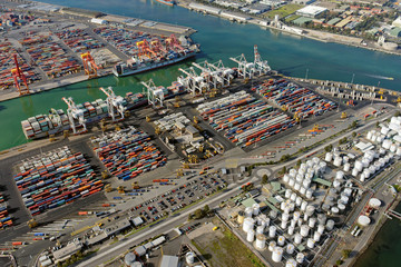 Aerial view of shipping containers, cranes and storage tanks in Melbourne, Australia