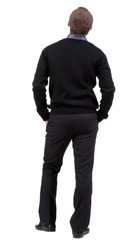 back view of Business man  looks ahead. Young guy in sweater watching.  Rear view people collection.  backside view of person.  Isolated over white background.