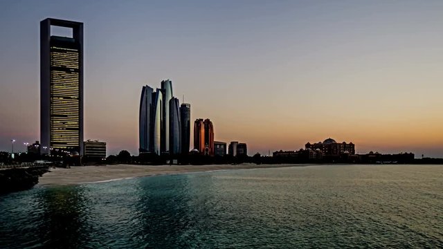  Timelapse of the Etihad Towers and mosque at sunset, Abu Dhabi, UAE
