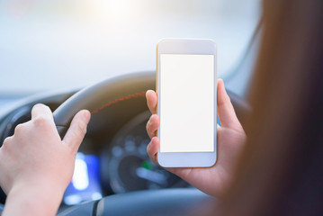 People using smart phone in car.