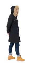 Back view woman in winter jacket  looking up © ghoststone