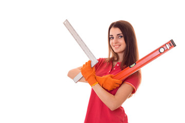 a young girl in a red shirt holding a measuring instruments close-up isolated on white background