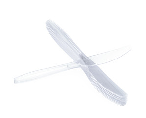 Pile of disposable knives isolated