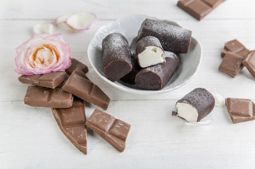 Chocolate and curd cheese at wooden background 