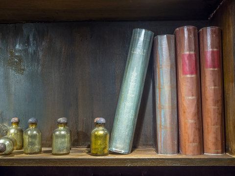 Potions and books on shelf