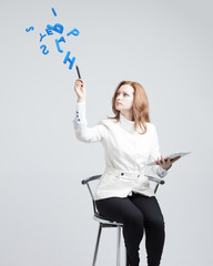 Woman working with a set of letters, writing concept.