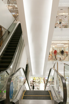modern automatic escalators in the mall lobby