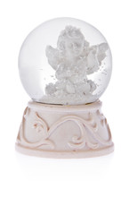 Snow globe with angel on a ceramic base.