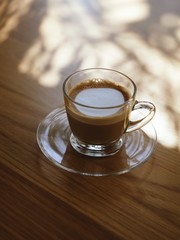 A glass of latte coffee.