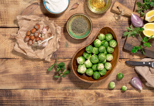 Raw brussels sprouts with different ingredients for cooking healthy food