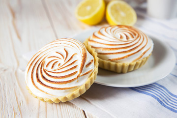 Tartlets with white cream and lemon curd shallow depth of field